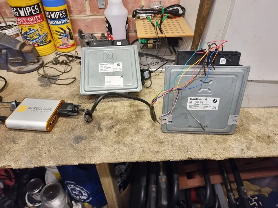 Two ECUs connected to an Autotuner tool on the workshop bench